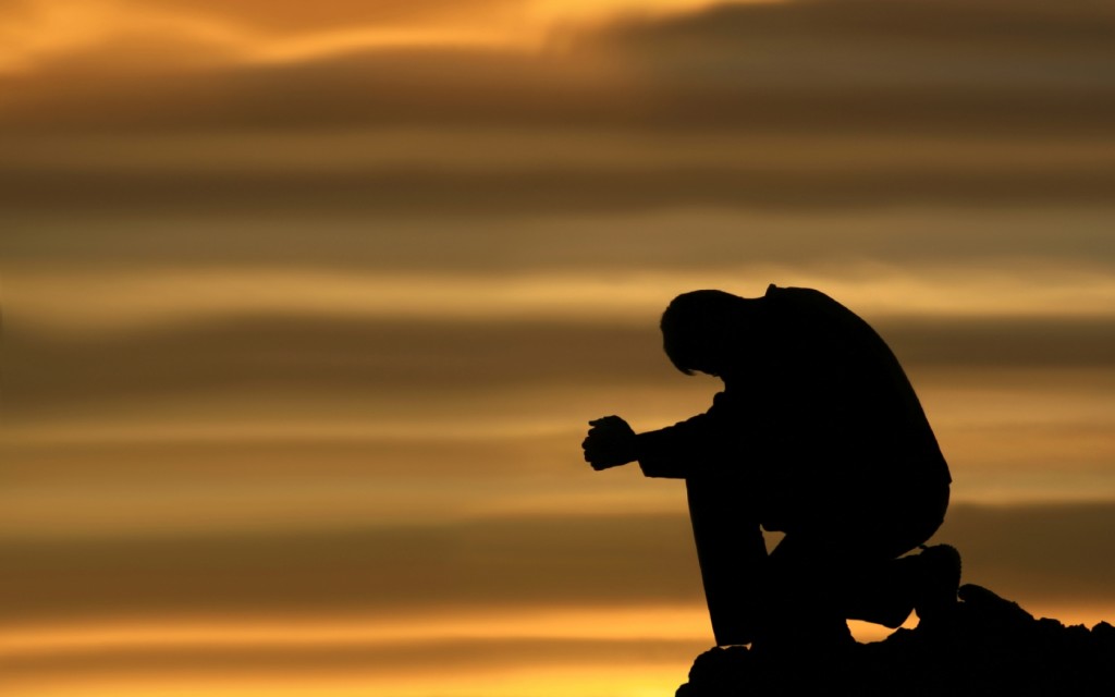 praying-and-kneeling-man